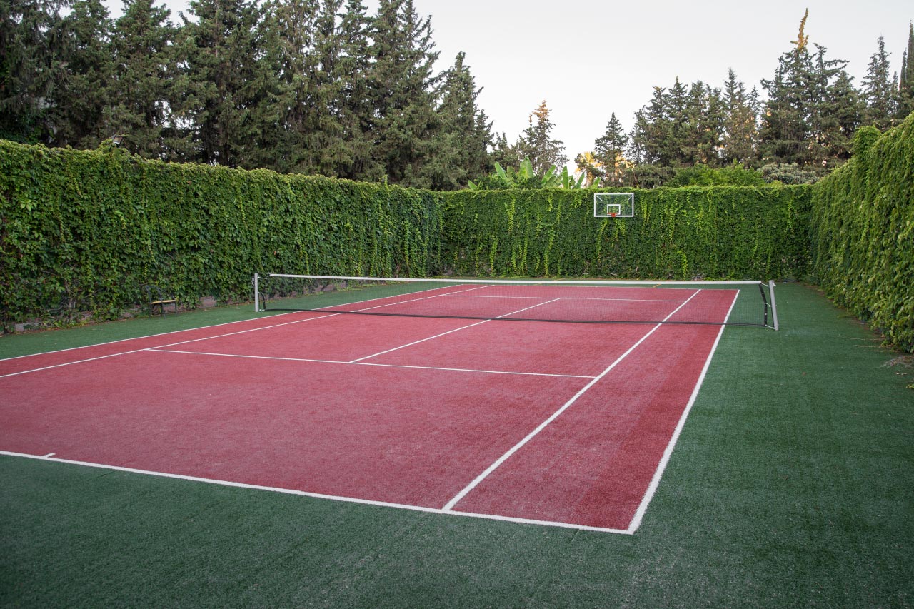 Newly resurfaced home tennis court in Dallas TX - Professional tennis court construction and resurfacing by Tennis Court Builders of Dallas